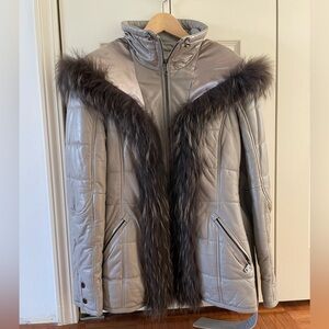 Genuine fur lined real lambs leather jacket with belt and great detail.
